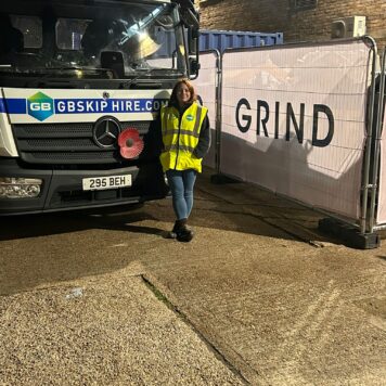 GB Skip Hire Worker In High-vis Jacket Next To Lorry At Grind Coffee Event